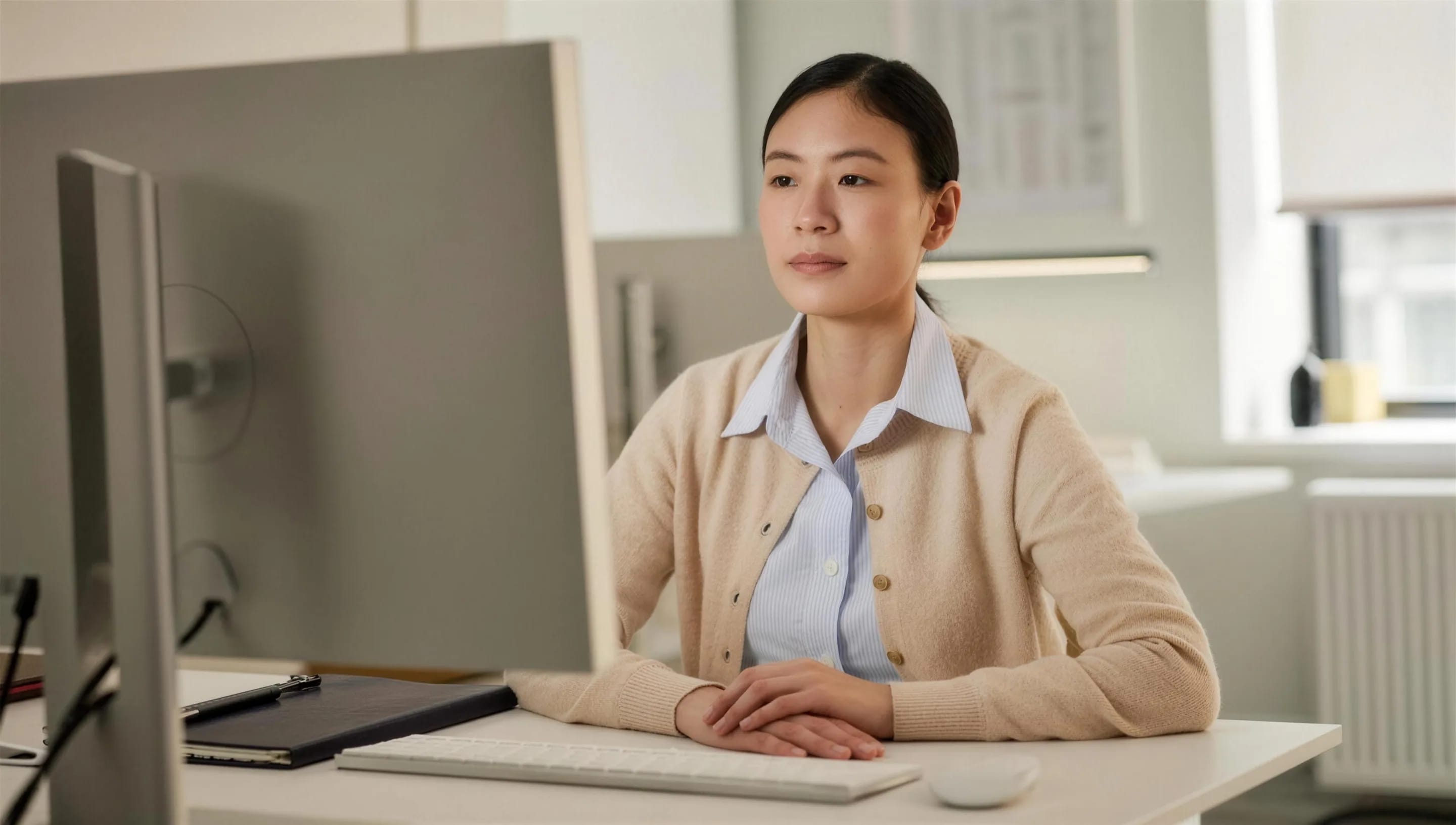 A clinic administrator at their desk