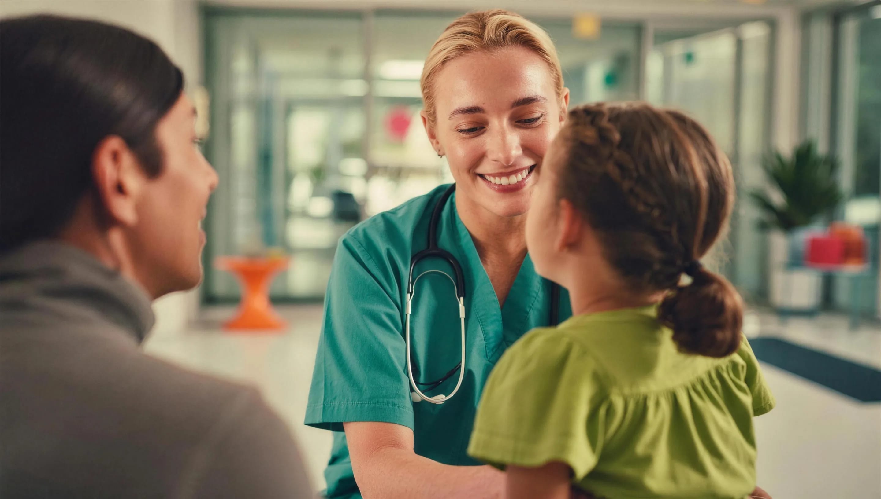 A doctor talking with a child and parent